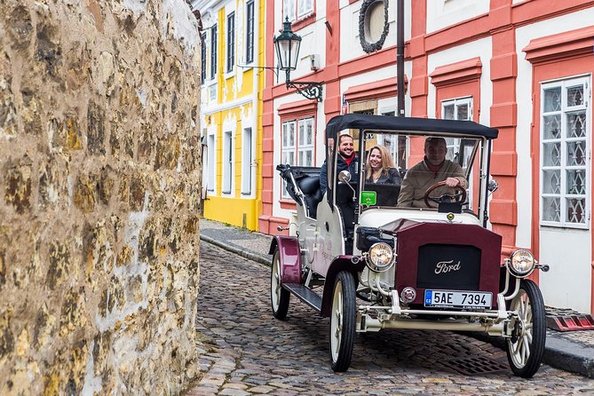 1,5 hour oldtimer convertible Prague sightseeing tour - Hotel pickup and a private car for up to five
