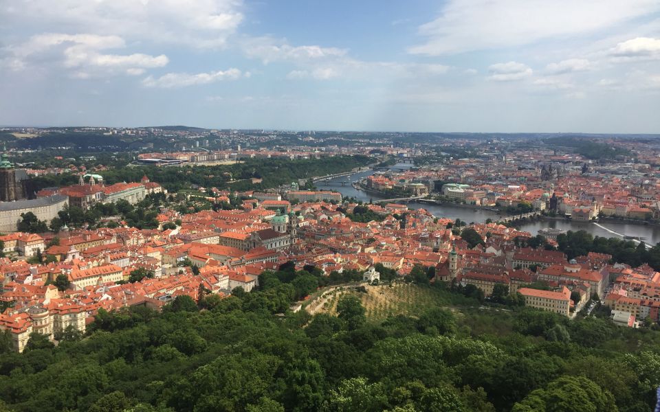 Prague "ALL-IN-ONE" City E-Bike Tour - Vltava River glide, Metronome views, and the castle approach
