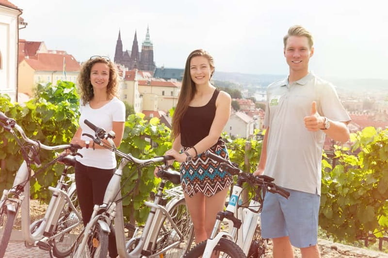 Prague: E-Bike or E-Scooter Tour with A Local Guide - Prague Castle area: your short walk, big skyline payoff