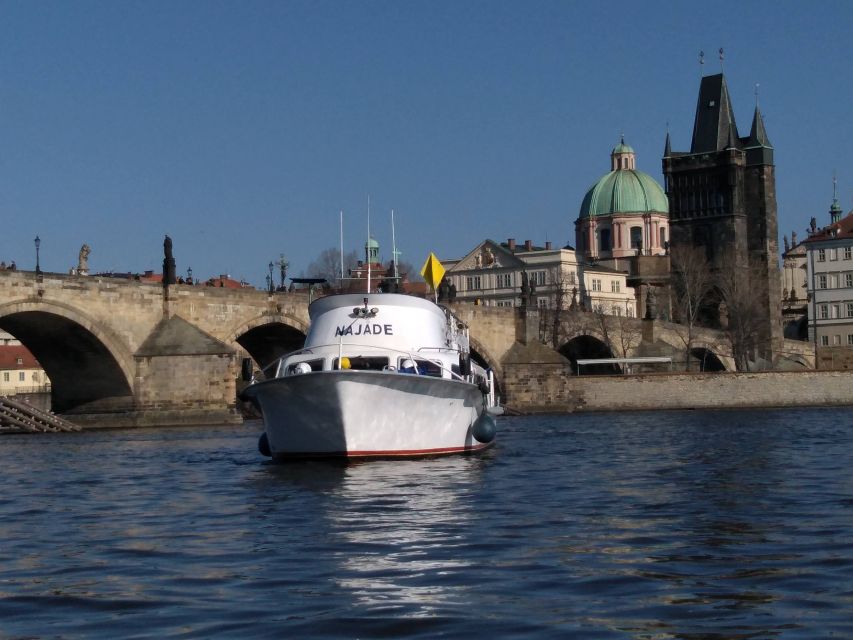 Prague: Vltava River Private Boat Party with Drinks - Charles Bridge from below: arches, statues, and the best kind of photo chaos